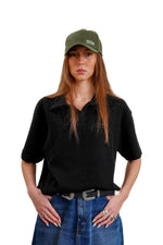 "Textured polo" in Black